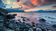 Colorful sunset over rocks at the shore of Lake