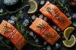 Three pieces of salmon with lemon and rosemary on top, surrounded by ice