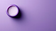 A blank cosmetic cream jar on the left side of a solid purple background with copyspace on the right