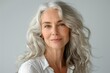 © James - Close-up portrait of a beautiful senior woman smiling, with gray hair isolated on a clean background. Healthy face skin care beauty, skincare cosmetics concept.