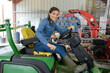 young female farmer and her tractor