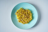 Fototapeta  - Broccoli sprouts on a blue plate. Healthy eating concept.