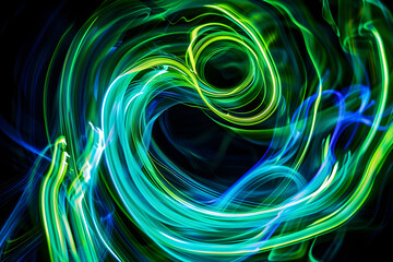 Dynamic neon swirls with green and blue glowing patterns. Captivating on black background.