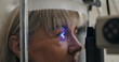 © peopleimages.com - Patient, slit lamp or ophthalmology as eye test, medicine or optometry as healthcare technology. Mature woman, eyeball or light in glaucoma, exam or consultation to diagnose lens, cornea or myopia