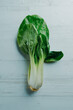 bok choy on a white wooden surface