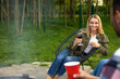 Couple enjoying outdoor party enjoying beverages during picnic