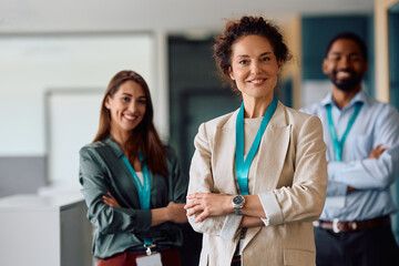 Wall Mural - Confident CEO and her business team in the office looking at camera.