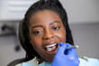 Portrait of a young african american woman having appointment at the dentists