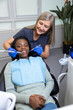 Young woman having a session of tooth treatment at the dentists