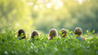 Children's heads among the green leaves of plants in the sunlight on a summer day