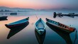 A fleet of traditional wooden fishing boats bobbing gently in a serene harbor at sunrise,with the soft glow of morning light illuminating the tranquil waters