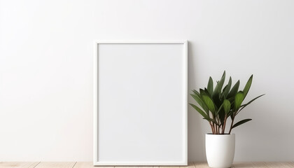 Wall Mural - A black frame with a white background sits on a wooden table