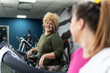 © BalanceFormCreative - Two beautiful, overweight women power through a fitness routine, determined to achieve their goals. Workout on the treadmill.