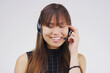 Virtual assistant, woman and headset with smile in studio for communication and customer service. Asian female person, consultant and microphone for talking, telemarketing and crm agent in studio