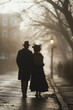 Silhouette of a senior couple walking away in a foggy historical city street. Early morning dew. Dress, black suit, hat. Historical romance concept. Walking side by side.