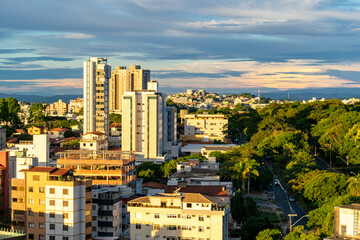 Residential buildings seen from above in the city of Belo Horizonte. Beautiful blue sky with clouds. Vehicle traffic. Horizontal.