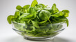 Fresh spinach in glass bowl close-up view