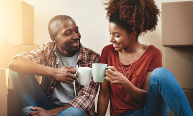 Poster - Black couple, cheers and coffee on floor of new house with bonding, support and happy for break from moving. People, homeowner and toast for property investment, dream home and relocation with boxes