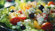 Fresh Mediterranean Greek salad with tomatoes, olives and feta cheese, natural light