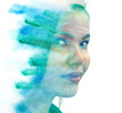 An Asian woman's portrait disappearing into blue watercolor in paintography