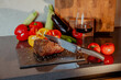 © Stanislava - Steak and vegetables with a glass of red wine on the table