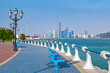 Waterfront view of Abu Dhabi with sea, skyscrapers from Corniche embankment