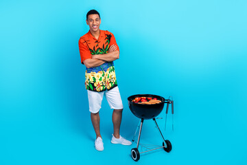 Sticker - Full length photo of good mood cool guy dressed print shirt arms folded grilling bbq isolated blue color background