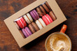 Coffee and colorful macaroons in gift box