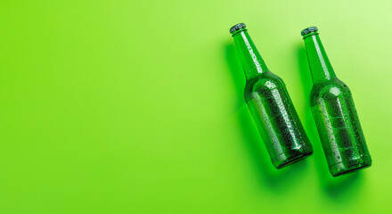 Wall Mural - Beer bottles on green background