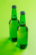 Beer bottles on green