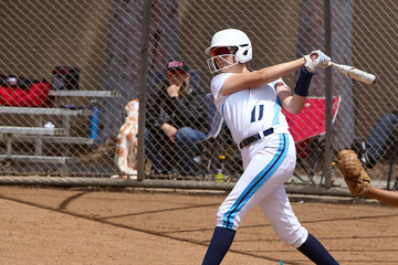 Canvas Print - Young Female fastpitch softball player playing club sports.