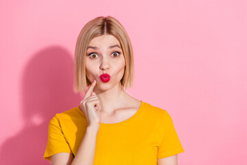 Canvas Print - Photo of excited funky lady dressed yellow t-shirt finger chin sending kiss isolated pink color background