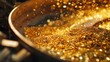 © BMMP Studio - Close-up of gold dust and flakes in a refining workshop