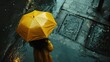 Woman walking on rainy day with yellow umbrella