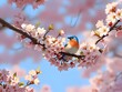 A bluebird perched on a cherry blossom branch with pink flowers against a blue sky background.