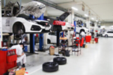 Wall Mural - Blurry Line of body Car with the equipment repair station in the garage shop. fix maintenance or checking by mechanic workshop. Business about of car or vehicle concept.