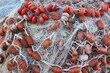 Large pile of fishing nets with floats.