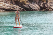Sportive Girl on the Paddle Board