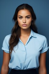 Canvas Print - Confident young professional woman in blue blouse