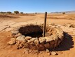 Abandoned well in arid desert landscape