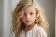 Portrait of a charming girl with white curly hair