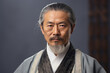 Portrait of an elderly Asian man dressed in classic ethnic clothes