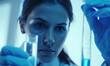 Female scientist working with test tube in laboratory