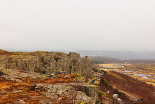 Steep Highlands And River Valley With Rocks In Thingvellir National Park, Home To Outstanding Natural Beauty. Breathtaking Icelandic Rocky Hills And Huge Mountain Walls, Arctic Scenery.