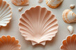 ceramic pink plates in the shape of shells on a textured background