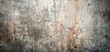 High-detail image showcasing the rough texture of a grunge concrete wall with visible cracks, stains, and patterns, suitable for background and design elements