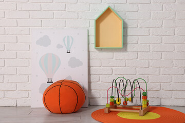 Sticker - Beautiful children's room with white brick wall and toys. Interior design