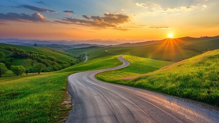 Wall Mural - Beautiful road in the green hills at sunset, winding asphalt country highway through beautiful landscape with clouds and sun rays, spring nature.