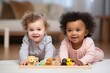 portrait of an african american toddler and caucasian baby playing toghether, diverse children smiling, black and white kids smiling
