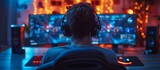 Fototapeta Do akwarium - A man is sitting in front of a computer monitor with a headset on
